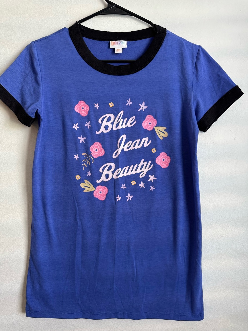LuLaRoe Blue Tee with Black Trim and Pink Floral Graphic